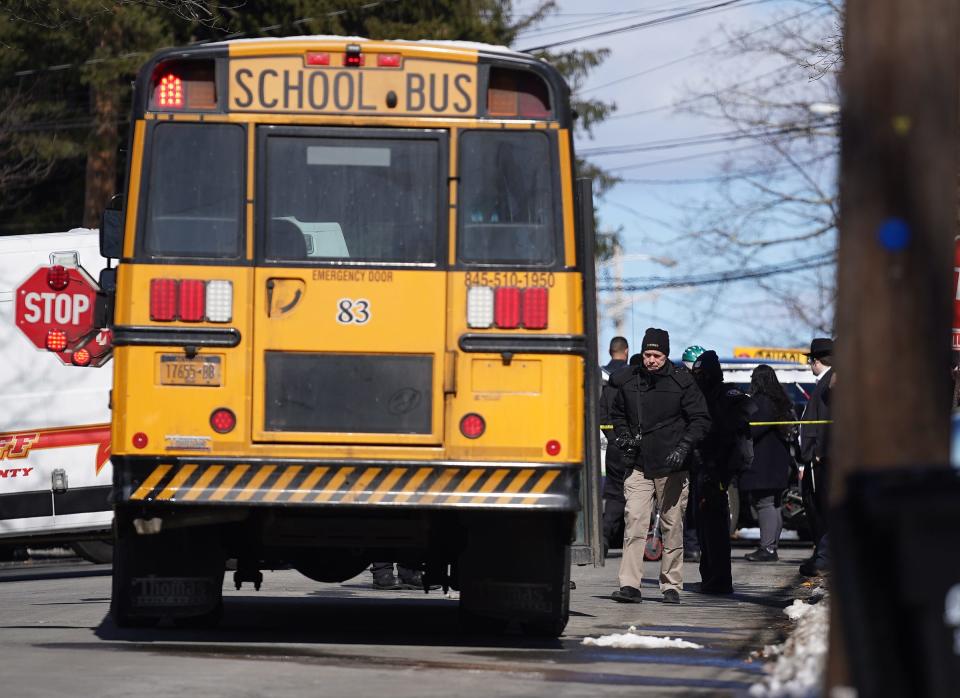 Police investigate the scene of a school bus crash on Madison Ave. in Spring Valley on Friday, Feb. 16, 2024.