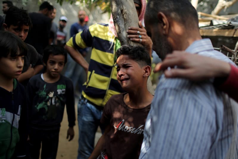 Boy mourns during the funeral of Palestinian Islamic Jihad militant Abdullah al-Belbasi, in the northern Gaza Strip