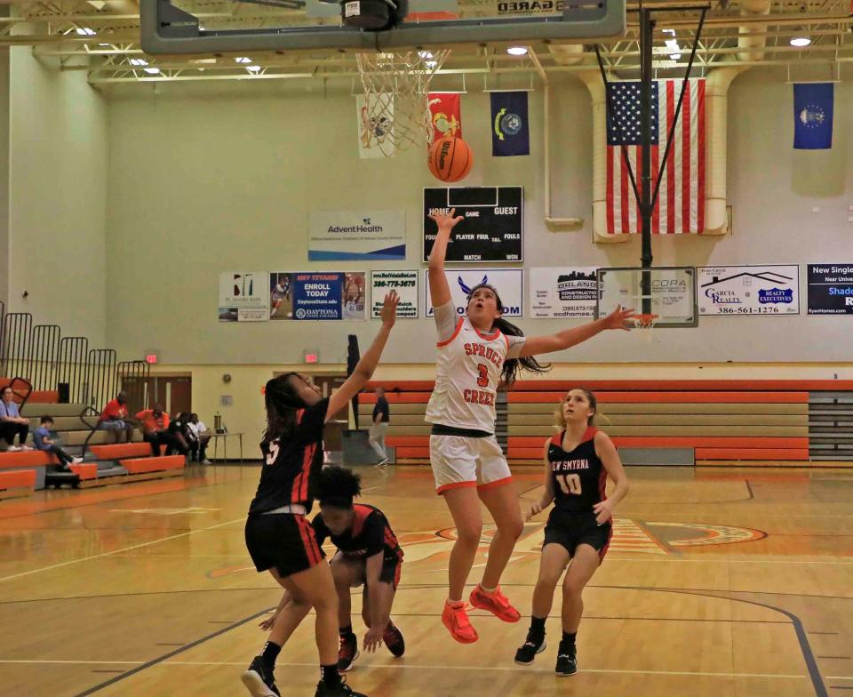 Olivia Olson (3) hits a floater during the Five Star Conference Tournament at University High School on Friday, Jan. 20, 2023.