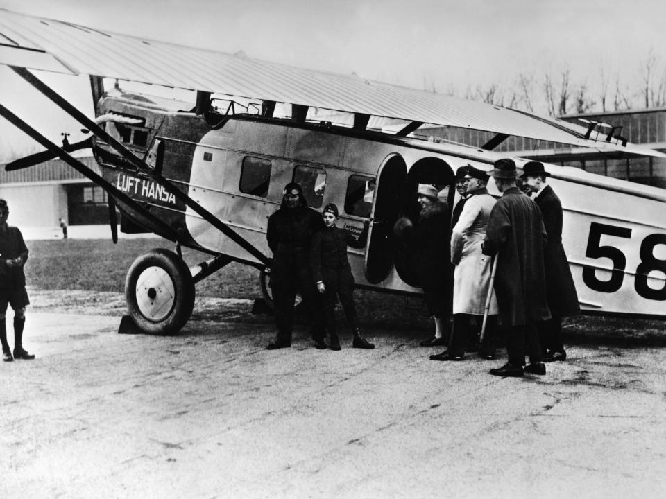 A group of passengers boarding a Lufthansa Dornier Komet III plane in 1926.