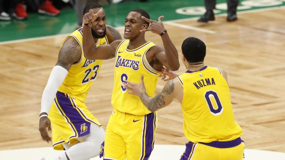 Lakers guard Rajon Rondo (c) celebrates his game-winning basket against the Boston Celtics
