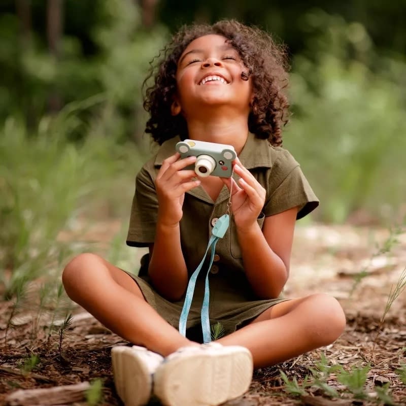 a child holds the camera