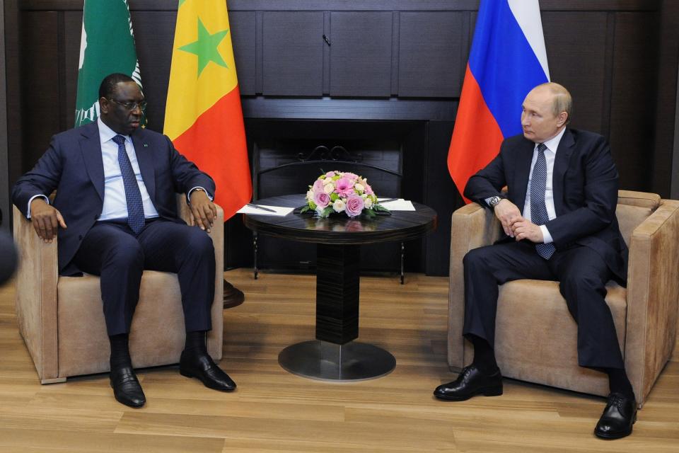 Russian President Vladimir Putin, right, listens to Senegalese President and the chairman of the African Union Macky Sall during their meeting in the Bocharov Ruchei residence in the Black Sea resort of Sochi, Russia, Friday, June 3, 2022. (Mikhail Klimentyev, Sputnik, Kremlin Pool Photo via AP)