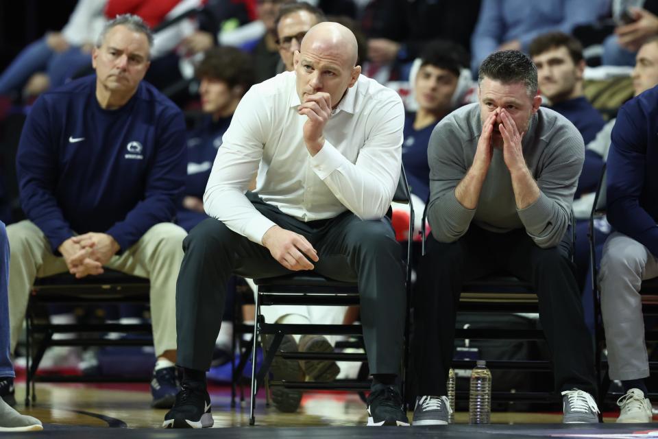 Feb 10, 2023; Piscataway, NJ, USA;  Penn State Nittany Lions head coach Cael Sanderson (center) looks on during the match against the Rutgers Scarlet Knights at Jersey Mike’s Arena. Mandatory Credit: Vincent Carchietta-USA TODAY Sports