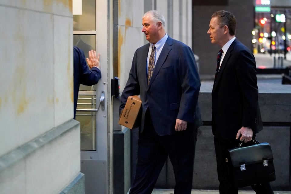 Former Ohio House Speaker Larry Householder, center, walks into Potter Stewart U.S. Courthouse with his attorneys Jan. 20,