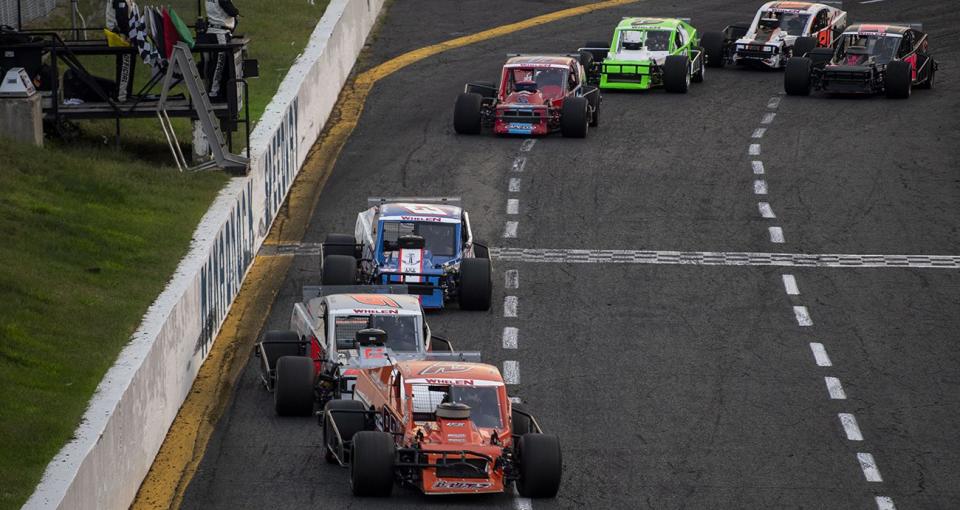 Modified cars race during the Winchester Fair for the NASCAR Whelen Modified Tour at Monadnock Speedway in Winchester, New Hampshire on September 9, 2023. (Armond Feffer/NASCAR)