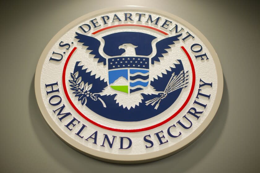FILE - Homeland Security logo is seen during a joint news conference in Washington, Feb. 25, 2015. Nina Jankowicz, the former head of a widely criticized disinformation board, faced a torrent of sexist profanities on social media and menacing emails filled with rape or death threats. And she is not alone as women around the globe who have risen to powerful government positions have faced an overwhelming crush of online harassment, stalking and abuse. (AP Photo/Pablo Martinez Monsivais, File)