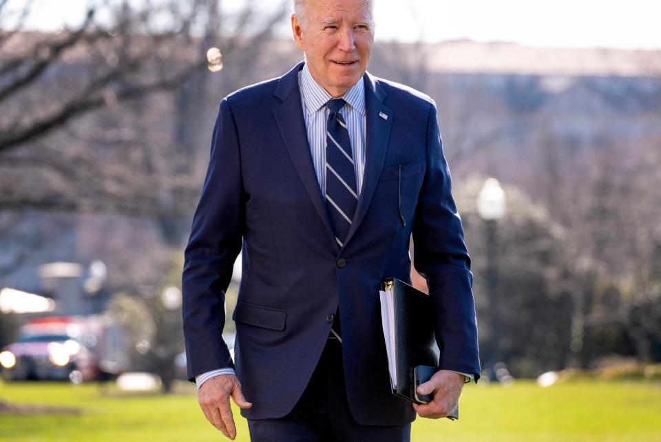 President Joe Biden walks toward members of the media as he arrives at the White House in Washington, Monday, Feb. 19, 2024, after returning from Rehoboth Beach, Del.