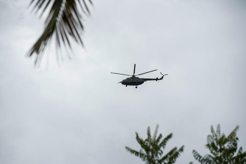 A military helicopter flies over Sanhlan