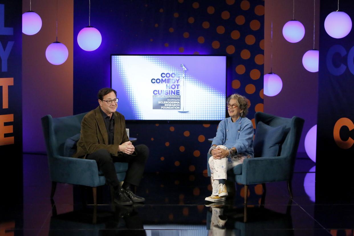 (L-R) Bob Saget and Susan Feniger speak onstage during the Cool Comedy-Hot Cuisine Virtual Event on Oct. 17, 2021, in Burbank, Calif.