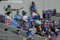 Supporters of Fiji wave flags in the stands during the women's rugby bronze medal match between Fiji and Britain at the 2020 Summer Olympics, Saturday, July 31, 2021 in Tokyo, Japan. (AP Photo/Shuji Kajiyama)