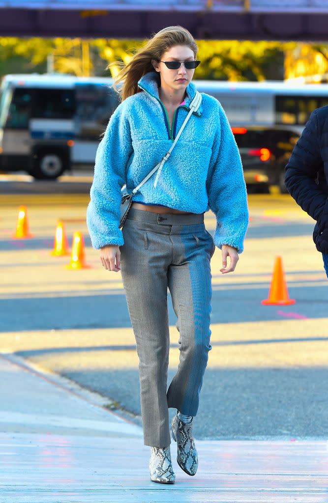 Gigi Hadid was recently photographed out and about in a £350 blue fuzzy zip-up by Sandy Liang [Photo: Getty]