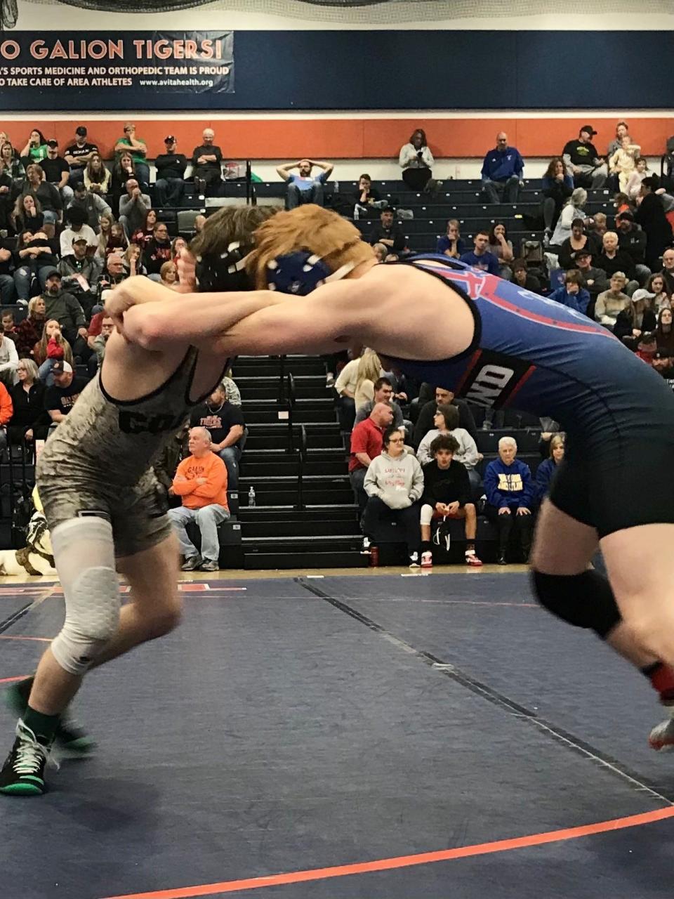 Highland's Brendan Lester, right, competes at the Mid Ohio Athletic Conference Wrestling Tournament last season in Galion.