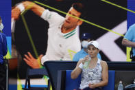 Ash Barty of Australia takes a drink during a break in her first round match against Lesia Tsurenko of Ukraine at the Australian Open tennis championships in Melbourne, Australia, Monday, Jan. 17, 2022. (AP Photo/Hamish Blair)