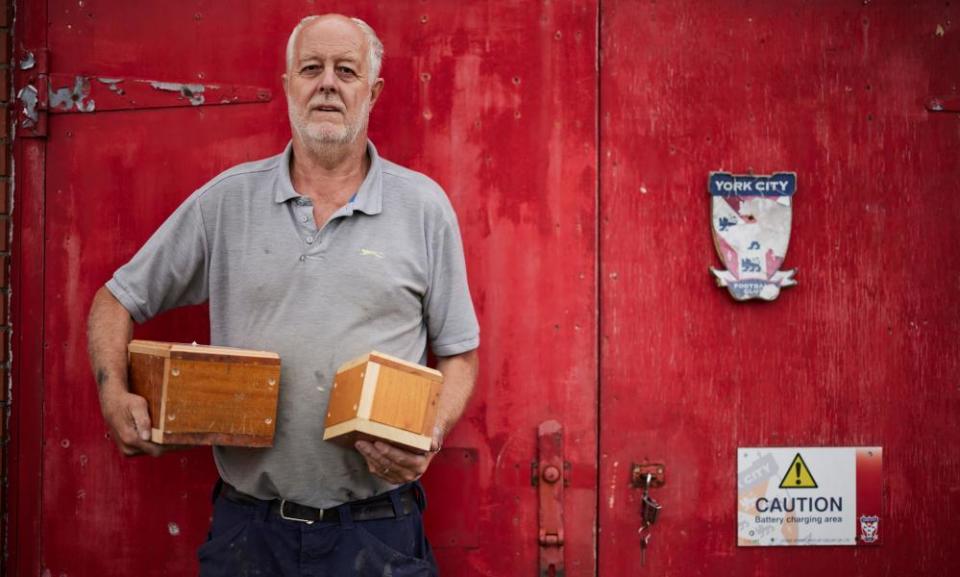 Groundsman Mal Ibbetson with the small caskets he has made for the ashes that have been excavated from under the pitch.