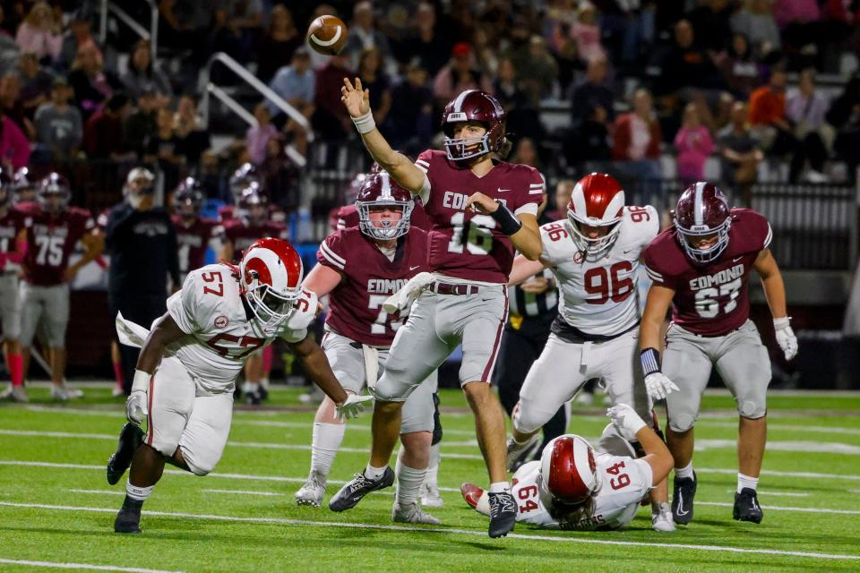 David McComb of Edmond Memorial throw a touchdown pass against Owasso in their football game Thursday, Oct. 19, 2023 in Edmond, Ok.