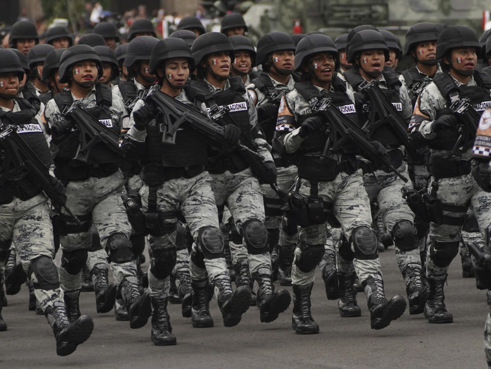 National Guards march during the annual Independence Day military parade in the capital's main square, the Zocalo, in Mexico City, Friday, Sept. 16, 2022. (AP Photo/Marco Ugarte)