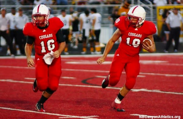 New Braunfels Canyon football plays on its red field