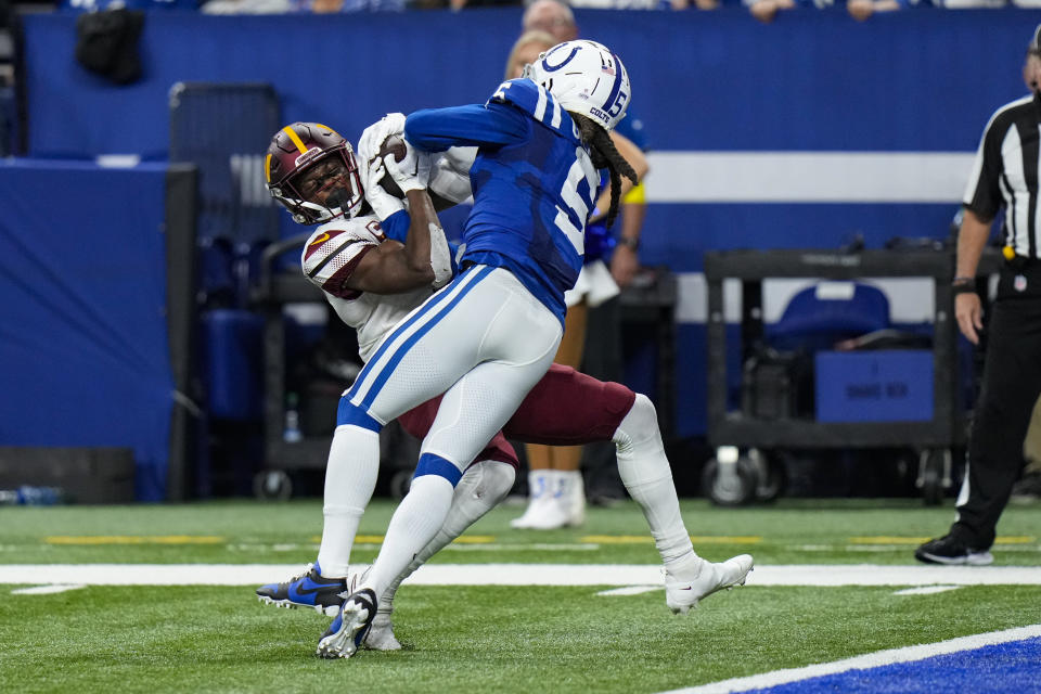 Washington Commanders wide receiver Terry McLaurin (17) makes a catch over Indianapolis Colts cornerback Stephon Gilmore (5) in the last minute of the second half of an NFL football game in Indianapolis, Fla., Sunday, Oct. 30, 2022. (AP Photo/AJ Mast)