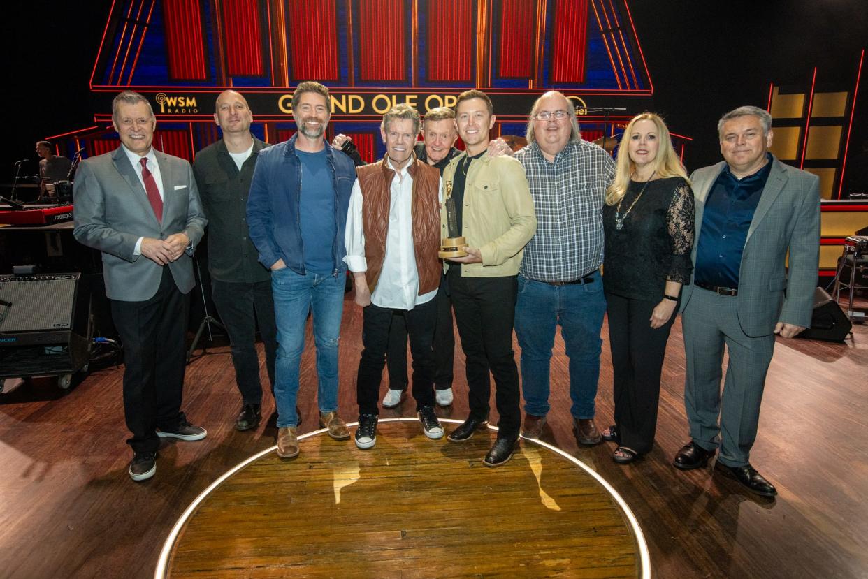 Opry host Bill Cody; George Couri, Josh Turner, Randy Travis, Bill Anderson, Scotty McCreery, Scott Stem; Gina Keltner, Associate Producer, Talent, Grand Ole Opry; Dan Rogers, Sr Vice President/Executive Producer, Grand Ole Opry -- at Grand Ole Opry, April 20, 2024