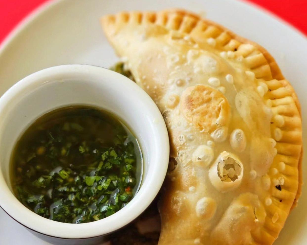 On empanada menu at Palm Beach Meats: a wagyu picadillo-stuffed empanada with chimichurri.