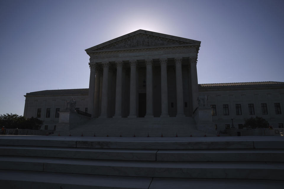 FILE - This June 29, 2021, file photo shows the U.S. Supreme Court on Capitol Hill in Washington. The Supreme Court is wrapping up its first all-virtual term, with decisions expected in a key case on voting rights and another involving information California requires charities to provide about donors. (AP Photo/J. Scott Applewhite, File)