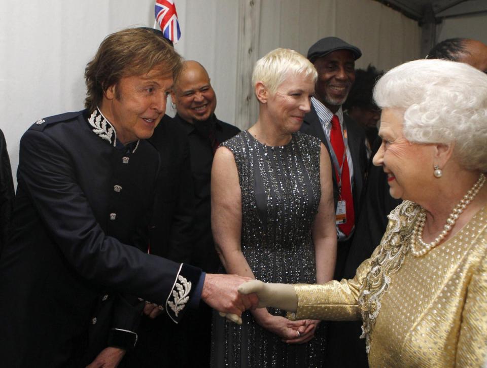 Paul McCartney and Annie Lennox: The monarch shakes hands with Sir Paul McCartney backstage after the Diamond Jubilee Buckingham Palace concert as Annie Lennox stands to the side, 4 June 2012 (Getty Images)