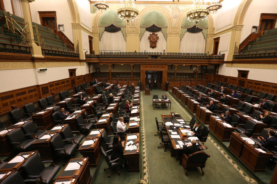 MPPs applaud as emergency legislation aimed at protecting workers who are forced to stay home due to the COVID-19 pandemic is passed in the Ontario Legislature. The Province of Ontario held a 1 pm emergency sitting of the legislator to pass COVID-19 legislation. Just 24 MPPs from all parties will be on hand so they can maintain social distancing in the house. in Toronto. March 19, 2020. (Steve Russell/Toronto Star via Getty Images)