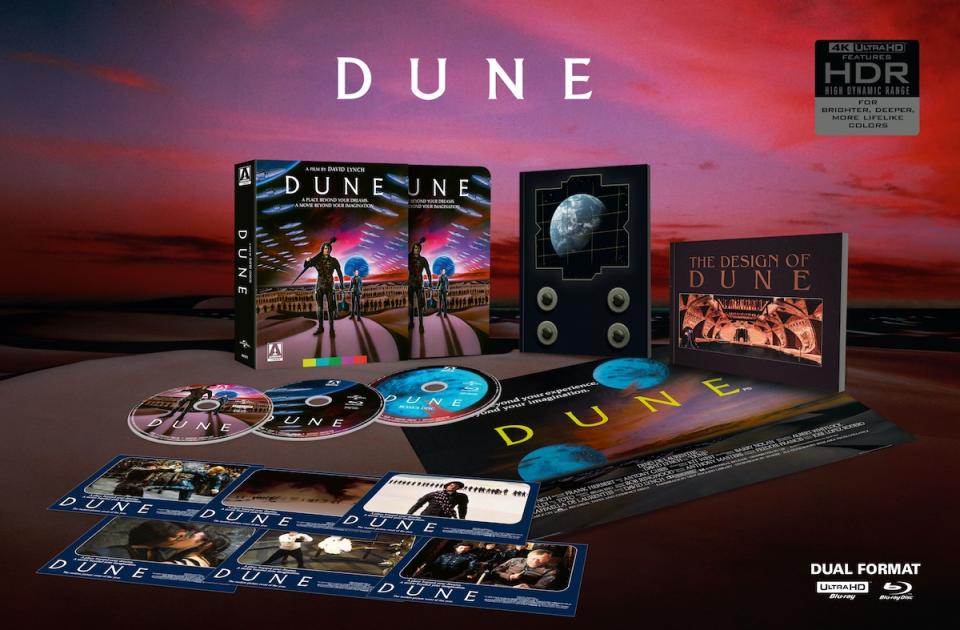 An open 4K box set of Dune, with posters postcards, blu-ray discs, two book, posters, and art, all against a space background