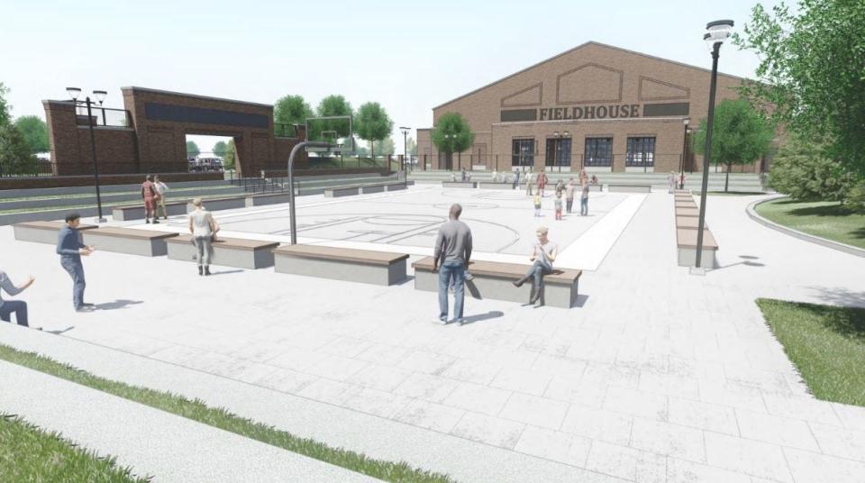 A rendering shows a view of the outdoor court between the two buildings of the Kettlestone Central Sports Complex.