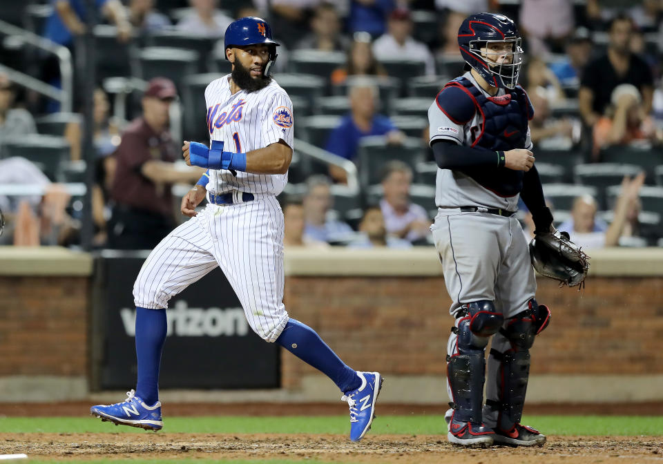 NEW YORK, NEW YORK - AUGUST 21:  Amed Rosario #1 of the New York Mets scores the tying run in the 10th inning as Roberto Perez #55 of the Cleveland Indians defends at Citi Field on August 21, 2019 in the Flushing neighborhood of the Queens borough of New York City.The New York Mets defeated the Cleveland Indians 4-3 in 10 innings. (Photo by Elsa/Getty Images)