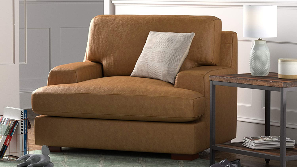 Let this oversized armchair engulf you in comfort.