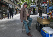 In this Nov. 4, 2019 photo, retired Emilio Monardes, 78, works as a street merchant in downtown Santiago, Chile. More than 1.2-million Chileans receive a pension that is less than $216 a month, well below the minimum salary of $400. Many retirees work in the informal sector to make ends meet. (AP Photo/Esteban Felix)
