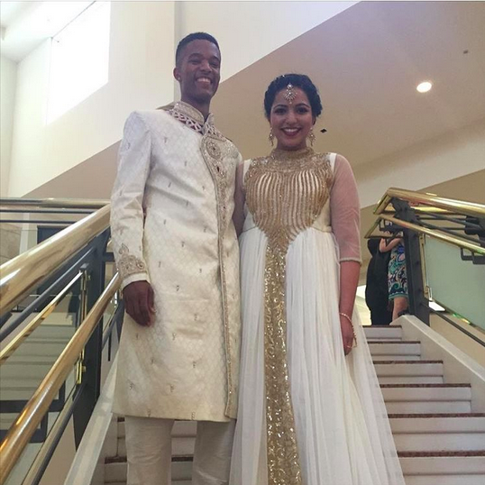 This couple looks like absolute royalty in these glittering gold-and-ivory ensembles.