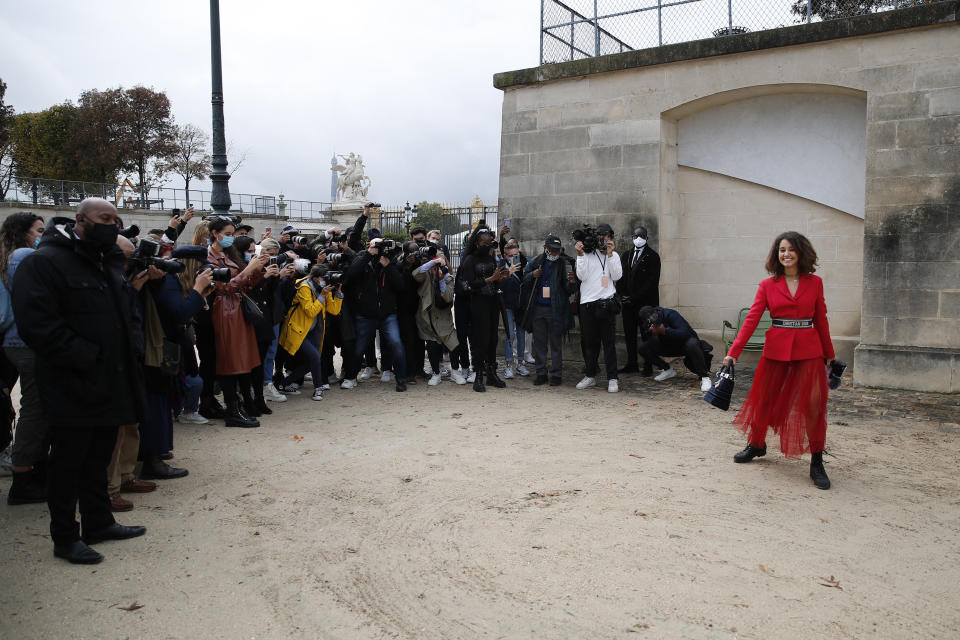 Influencer Lena Mahfouf, knotted as Lena Situations, strikes a pose after Dior's Spring-Summer 2021 fashion collection presented Tuesday, Sept. 29, 2020 during the Paris fashion week. (AP Photo/Francois Mori)