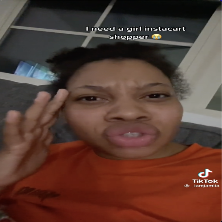 Screengrab of a TikTok by user _iamjamila of her looking into the camera and holding a hand to her head