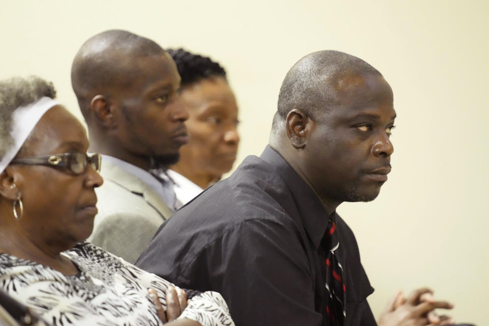 Eddie Terrell Parker, right, and Michael Corey Jenkins, center, listen as one of six former Mississippi law officers pleads guilty to state charges at the Rankin County Circuit Court in Brandon, Miss., Monday, Aug. 14, 2023. Six white former Mississippi law officers pleaded guilty to state charges on Monday for torturing the two Black men in a racist assault. All six had recently admitted their guilt in a connected federal civil rights case.(AP Photo/Rogelio V. Solis)