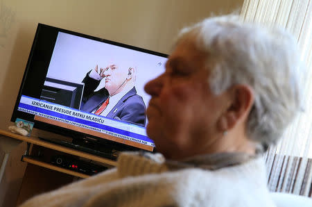 Vasva Smajlovic 74, who lost her husband and the husband of her daughter along with more than 30 members of her close family, watches a television broadcast of the court proceedings of former Bosnian Serb general Ratko Mladic in Potocari near Srebrenica, Bosnia and Herzegovina, November 22, 2017. REUTERS/Dado Ruvic