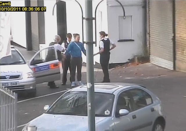 A CCTV still of Nicola Edgington being arrested for murder.