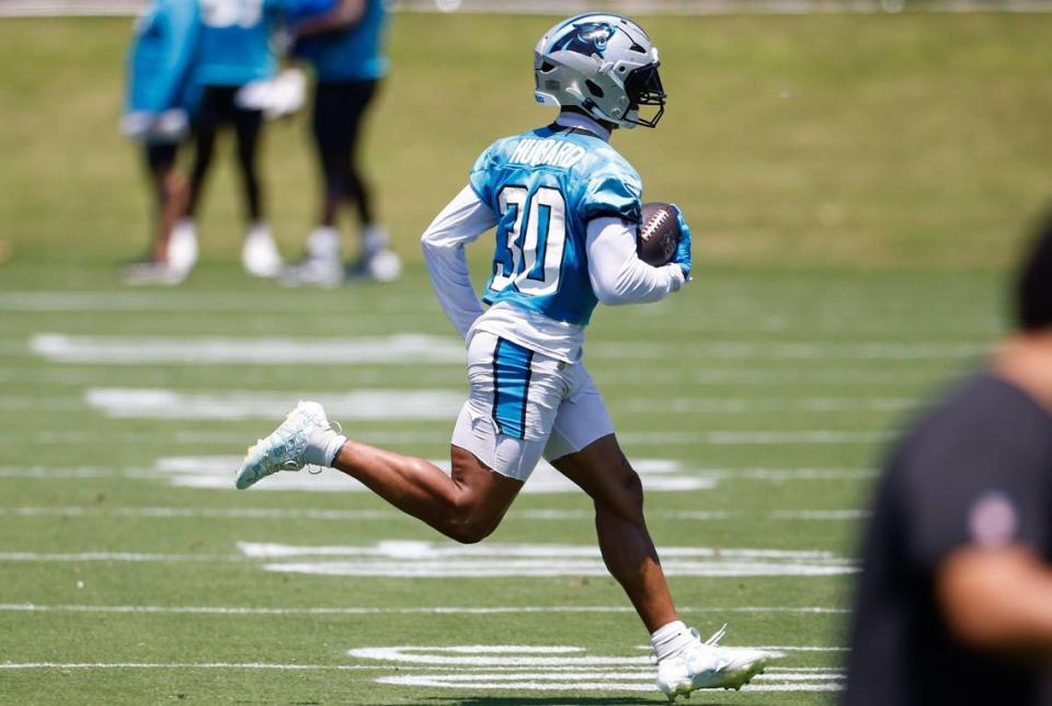 Panthers running back Chuba Hubbard (30) runs with the ball during minicamp practice in Charlotte, NC on Tuesday, June 11, 2024.