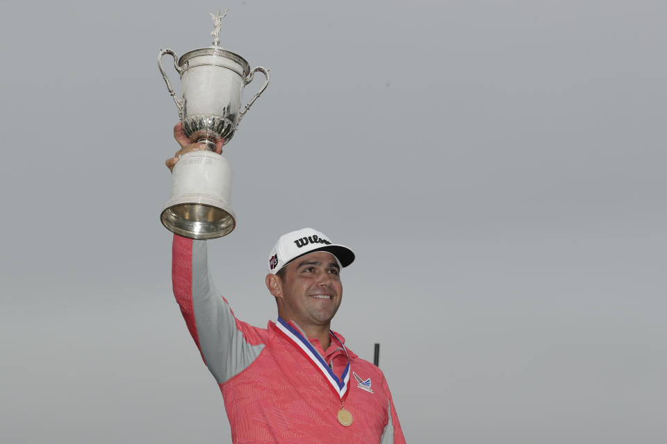 Gary Woodland celebrates with the trophy after winning the U.S. Open Championship golf tournament Sunday, June 16, 2019, in Pebble Beach, Calif. (AP Photo/Matt York)