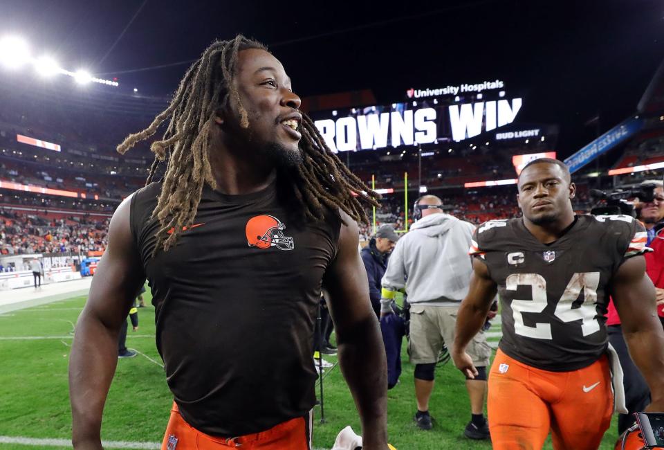 Browns running back Kareem Hunt, left, celebrates as he comes off the field with Nick Chubb after beating the Pittsburgh Steelers 29-17, Thursday, Sept. 22, 2022, in Cleveland.