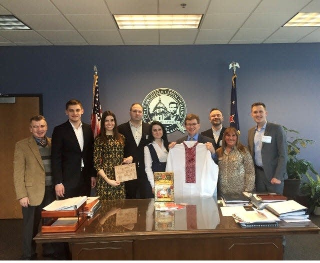 Mayor Ivan Fedorov of Melitopol, Ukraine, second from left, visits Springfield and Mayor Jim Langfelder (holding shirt) in this February 2018 image. Fedorov, who was abducted by Russian soldiers and freed on March 16, was mentioned by Pope Francis during the Easter Vigil at St. Peter's Square Saturday. Fedorov attended the service.