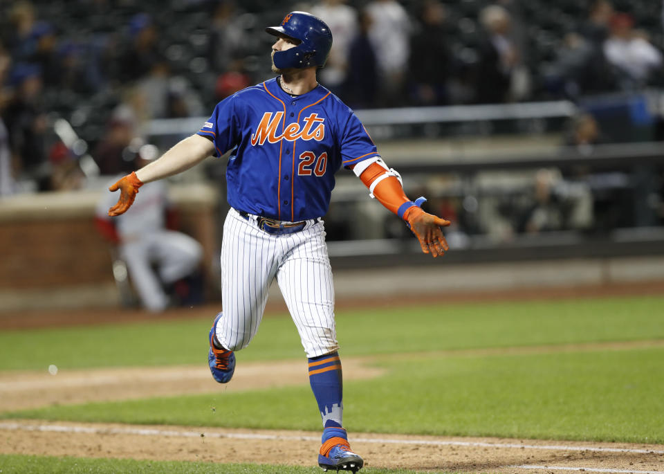 New York Mets Pete Alonso reacts back toward the Mets dugout after hitting a game-tying, eighth-inning, solo home run in a baseball game against the Washington Nationals, Tuesday, May 21, 2019, in New York. (AP Photo/Kathy Willens)