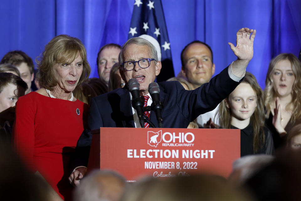 Republican Ohio Gov. Mike DeWine, center, speaks during an election night watch party as his wife, Fran, stands next to him Tuesday, Nov. 8, 2022, in Columbus, Ohio. (AP Photo/Jay LaPrete)