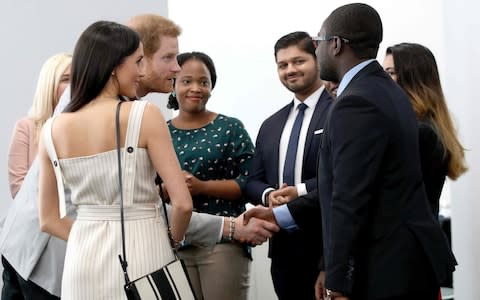 Prince Harry and Meghan Markle at the Commonwealth Youth Forum - Credit: Yui Mok