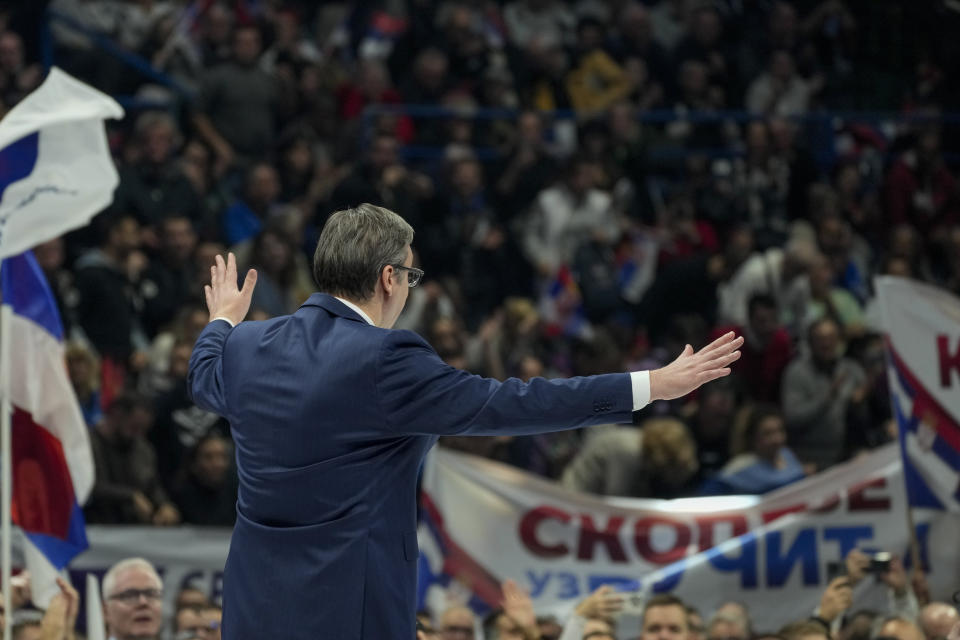 Serbian President Aleksandar Vucic waves to his supporters during a pre-election rally of his ruling Serbian Progressive Party in Belgrade, Serbia, Saturday, Dec. 2, 2023. Serbia's President Vucic is pushing hard to reassert his populist party's dominance at this weekend's early parliamentary and local elections that observers say are being held in an atmosphere of intimidation and media bias. (AP Photo/Darko Vojinovic)