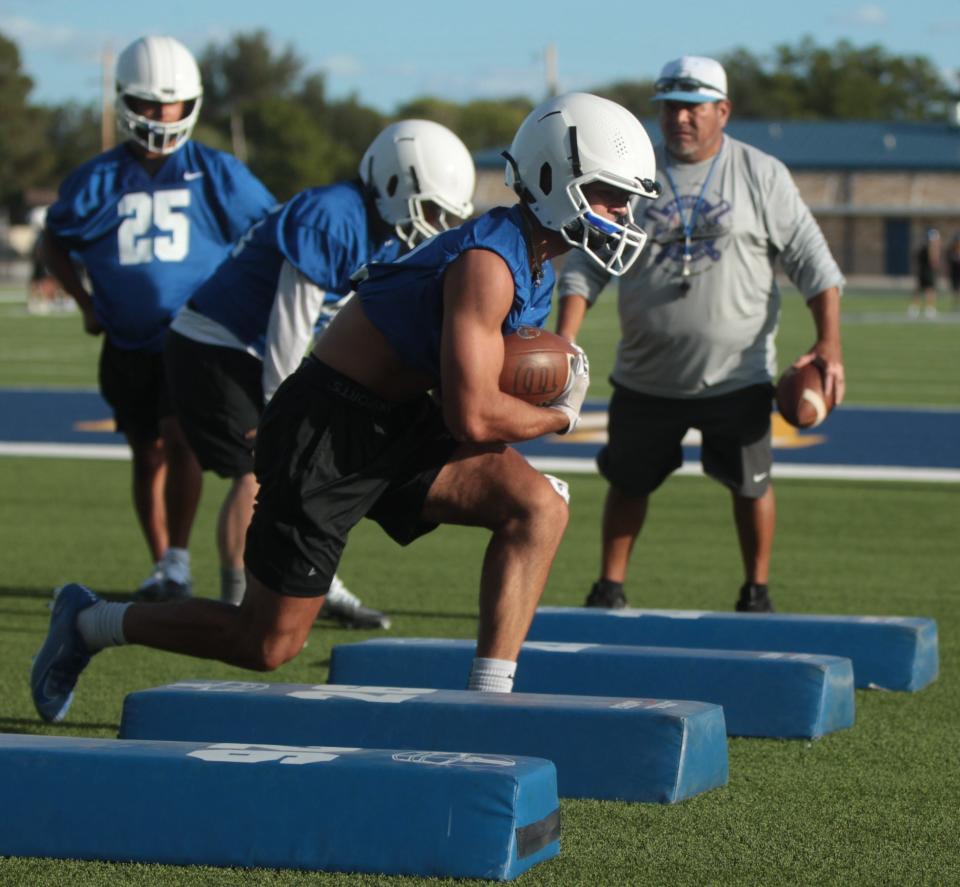 Reagan County High School's A.J. Avalos participates in a running back drill during football workout Monday, Aug. 1, 2022, at James H. Bird Memorial Stadium in Big Lake.