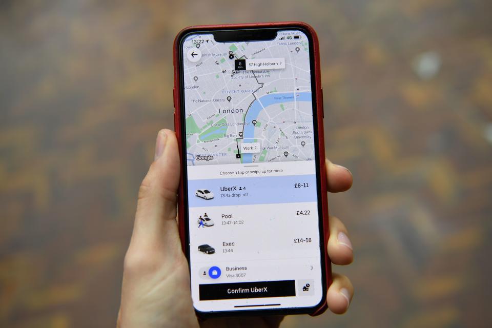 An illustration of Uber ride-hailing app page showing a trip to be taken in central London on November 25, 2019. - London's transport authority today refused to renew an operating licence for ride-hailing giant Uber because of safety and security concerns. (Photo by Daniel LEAL-OLIVAS / AFP) (Photo by DANIEL LEAL-OLIVAS/AFP via Getty Images)