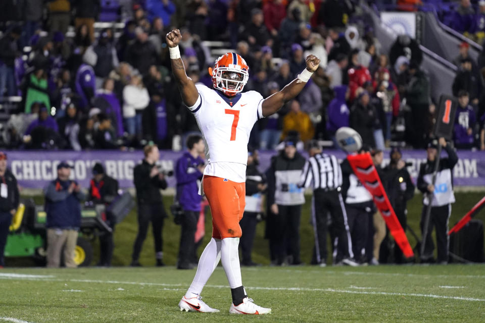 Illinois wide receiver Brian Hightower celebrates after Illinois defeated Northwestern 41-3 in an NCAA college football game in Evanston, Ill., Saturday, Nov. 26, 2022. (AP Photo/Nam Y. Huh)